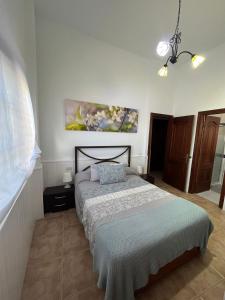 Postel nebo postele na pokoji v ubytování Casa El Almendrillo