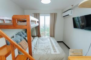 Giường trong phòng chung tại Saekyung Condo near Airport with Seaview & Tourist Spot +53 ảnh
