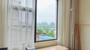 Mynd úr myndasafni af Cozy Li Riverside Inn í Guilin