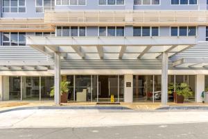 an office building with awning in front of it at Perfect accommodation for you in Levels Burbank in Manila