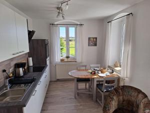 Kuchyň nebo kuchyňský kout v ubytování Hotel Heilbrunnen