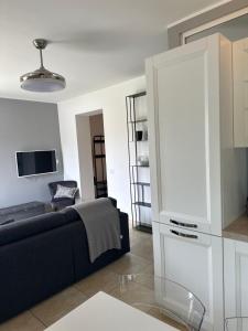 a living room with a couch and a tv at Agriturismo il maniero in Ancona