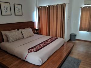 Postel nebo postele na pokoji v ubytování At Samui Haus
