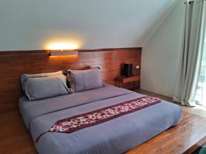 Postel nebo postele na pokoji v ubytování At Samui Haus