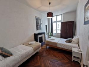 En eller flere senge i et værelse på Nouvelle pépite - Le Rayon vert