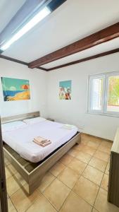 a bedroom with a bed in a room at Onda Marina Apartments in Forio d'Ischia