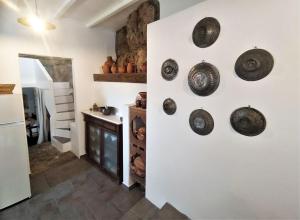 a hallway with plates on the wall in a house at Skyros BnB ANNA House in Brooke in Skiros