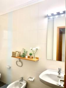 a bathroom with a sink and a mirror at Your Holiday Home - El Tablado - Tenerife Sur in El Escobonal +31 photos