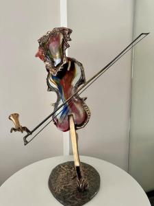 a metal art object on top of a table at Private bedrooms near Eiffel Tower in Paris
