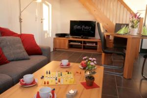 a living room with a chess game on a table at Sonnenschein 29 - Großenbrode in Grossenbrode