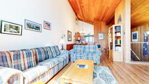 a living room with a couch and two chairs at Meadow Ridge #28 condo in Mammoth Lakes