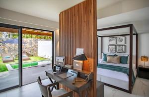 a bedroom with a desk and a bed in a room at Sea Diamond Boutique Hotel & Spa by Sea Resorts in Grand Gaube +67 photos