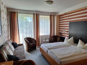 Postel nebo postele na pokoji v ubytování Hotel Heilbrunnen