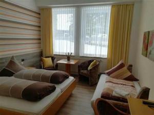 Postel nebo postele na pokoji v ubytování Hotel Heilbrunnen