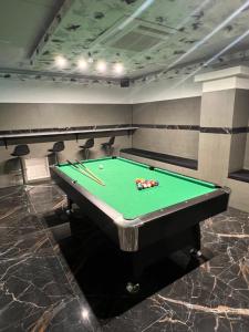 a pool table in a room with afits at Dream Home in Szentes