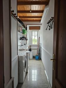 a laundry room with a washer and dryer at Vicia in O Vicedo +17 photos