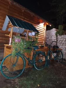 a bike parked in front of a building with flowers at Brvnara Fairy Tale in Cetinje