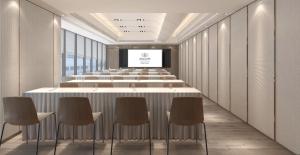 sala konferencyjna z długim stołem i krzesłami w obiekcie Ascott North Point Hong Kong w Hongkongu