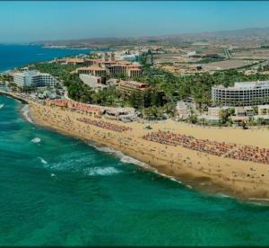 an aerial view of a beach with people on it at Apartamentos NICE CENTRAL BUILDING in El Tablero