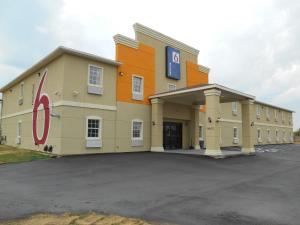 a large building with a parking lot in front of it at Motel 6-Jourdanton, TX in Jourdanton