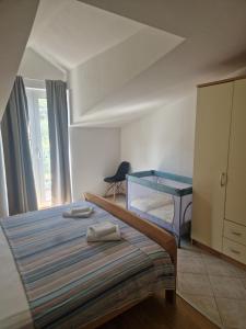 Postel nebo postele na pokoji v ubytování Apartmani "Ivan"