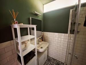 a bathroom with a sink and a toilet and a shower at Wohnung mit direktem Seeblick in Möhnesee +22 photos