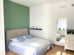 En eller flere senge i et værelse på TerracitoReggio Vari Appartamenti