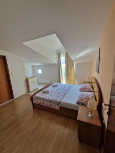 Postel nebo postele na pokoji v ubytování Apartmani "Ivan"