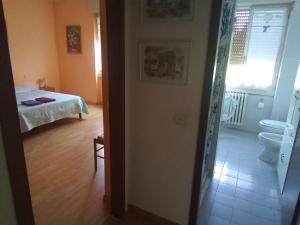Postel nebo postele na pokoji v ubytování Stanza ai Colli