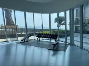 a gym with a bench in the middle of a building at Aurora Staycation I-City Shah Alam in Kampong Padang Jawa
