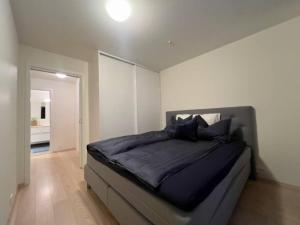 Postel nebo postele na pokoji v ubytování Sentral penthouse leilighet i Tromsø