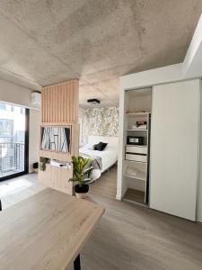 a living room with a table and a bed at Anywhere Palermo Soho in Buenos Aires +56 photos