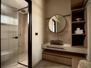 a bathroom with a sink and a mirror at Mayamor Villas, sea view to Tsilivi beach in Tsilivi +37 photos
