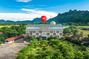 a hot air balloon flying over a hotel at Lisha Garden Resort in Vang Vieng