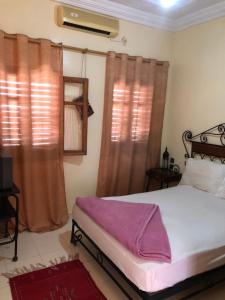 APPART AIGLE HOTEL客房内的一张或多张床位