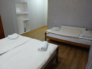 Postel nebo postele na pokoji v ubytování Mishgu Qor