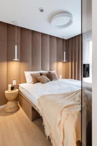 Postel nebo postele na pokoji v ubytování Green Port Boutique SPA Basen Apartament 128 Kołobrzeg Podczele Lwowska + 22 fotografií