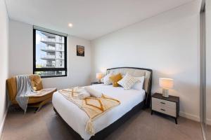 Ένα ή περισσότερα κρεβάτια σε δωμάτιο στο Lakeview Luxury 3Bedrooms Apt Wolli Creek close to Airport CBD +31 φωτογραφίες
