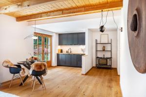a kitchen and dining room with a table and chairs at Chalet Flocke Appart Schneehase in Sankt Anton am Arlberg