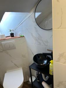 a bathroom with a white toilet and a mirror at Apartment Felix in Split +12 photos