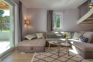 a living room with a couch and a table at Ferienhaus mit Privatpool für 8 Personen ca 120 qm in Mugeba, Istrien Istrische Riviera in Mugeba