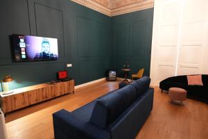 TV a/nebo společenská místnost v ubytování Suite Gimma 209