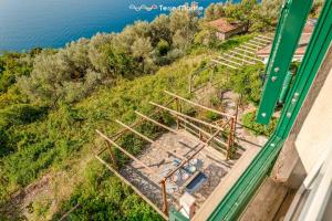an overhead view of a building on a hill next to the water at Blu Isola, Terre Marine in Corniglia +12 photos