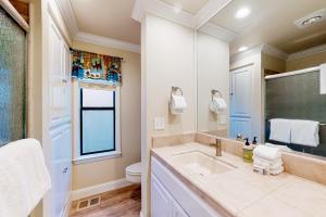 a bathroom with a sink and a toilet at Windwood Inn in Shaver Lake +22 photos