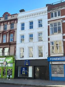 a white building on the side of a street at Patrick Street Townhouse in Cork