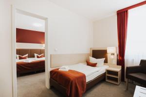 Postel nebo postele na pokoji v ubytování Hotel Wiggers
