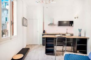 a kitchen with a desk and a table in a room at Il Palombaro in Riomaggiore