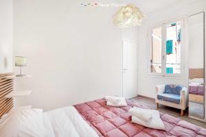 a white bedroom with a large bed and a window at Il Palombaro in Riomaggiore +9 photos