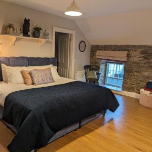 Voodi või voodid majutusasutuse Coachman's Loft toas