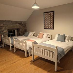 Voodi või voodid majutusasutuse Coachman's Loft toas